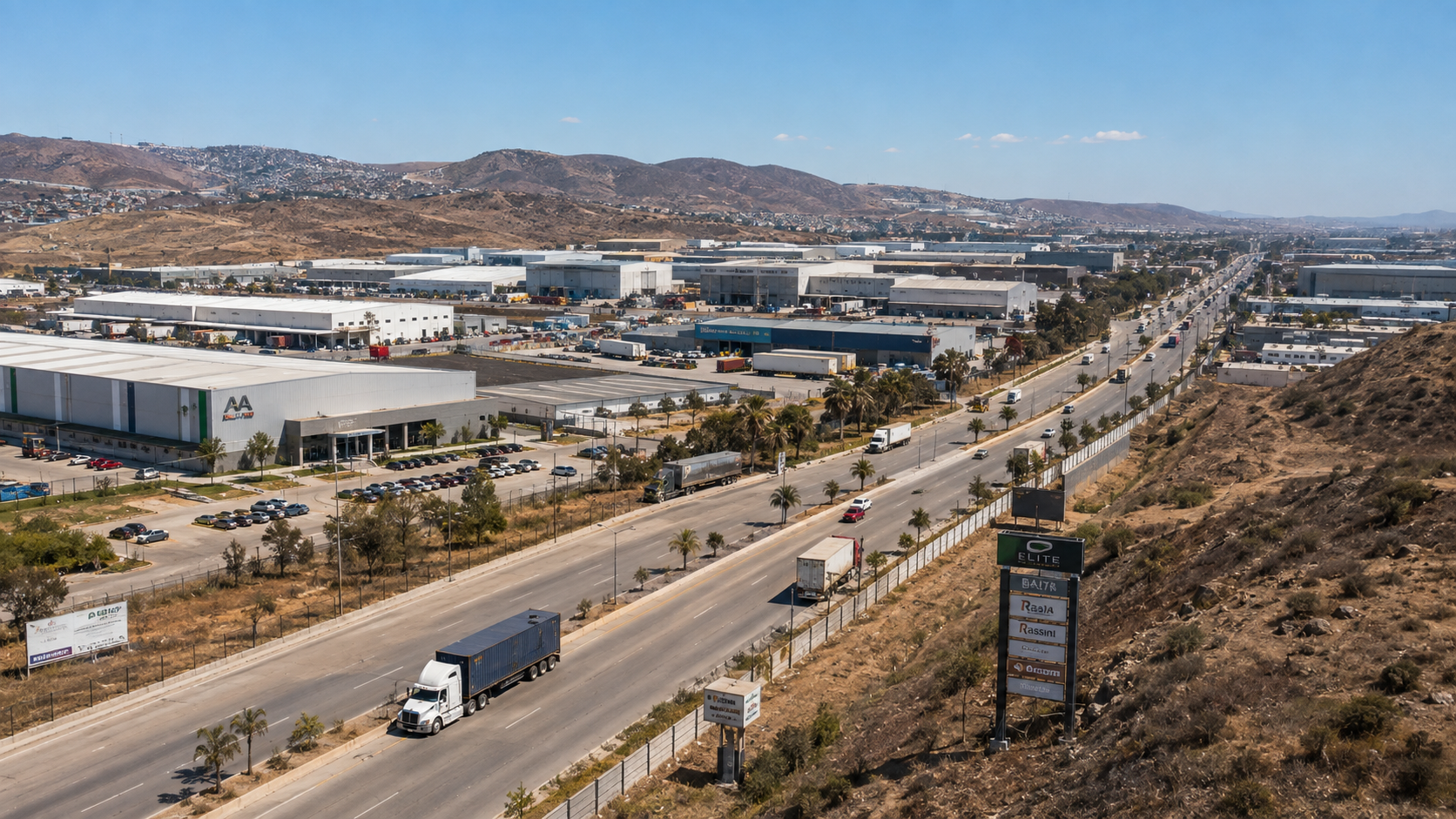 Industrial park in Tijuana with trucks moving along the corridor